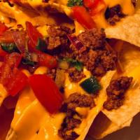 Nachos · Fresh made chips with jalepeno queso topped with pico