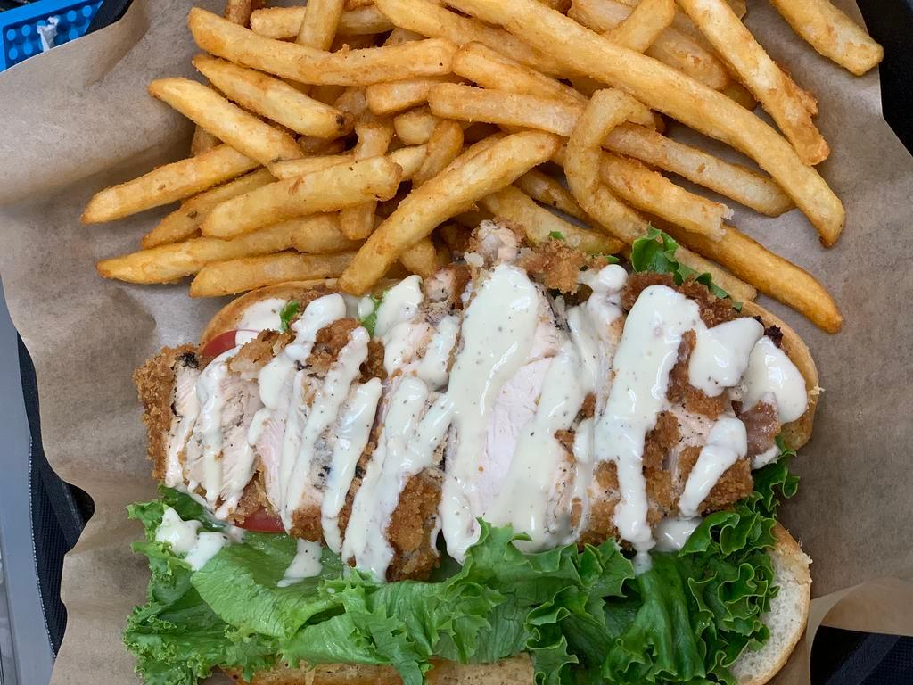Chicken Caesar Sub · Crispy or grilled chicken, fresh Romaine, tomato topped with Parmesan and Caesar dressing with mayo on a Parmesan-crusted hoagie. Served with fries or slaw.