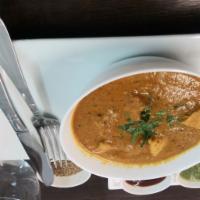 Chicken Curry · Tender pieces of chicken cooked in a seasoned authentic curry sauce.