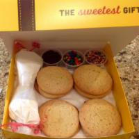 Happy Cookie Kit · Ingredients: 10 ea. Sugar Cookies, Baked. 3 ea. 2 oz. Toppings [your choice]. 2 ea. Icing Ba...