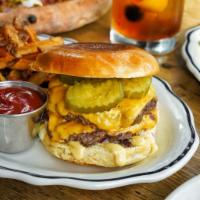 Mt. Royale Burger · two patties, american cheese, red onion, dijonnaise, pickles, served with fries