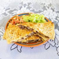 Steak Quesadillas · Cooked tortilla that is filled with cheese and folded in half. 