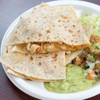 Chicken Quesadillas · Cooked tortilla that is filled with cheese and folded in half. 
