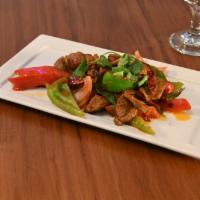 Rasila Lamb · Sliced, juicy lamb sauteed with black peppercorns, bell peppers, and onions. Gluten free.