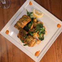 Tulsi Machhi-D · Salmon fillets marinated in a basil-based marinade, cooked in cylindrical clay oven. Served ...