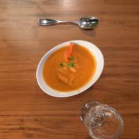 Butter Chicken-D · Dark meat chicken simmered in an onion, tomato, and cream-based sauce. Served with a side of...