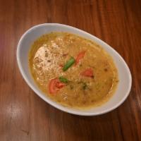 Dal Tarka-D · Slow simmered yellow lentils with an exotic house glaze. Served with a side of our vegan bas...