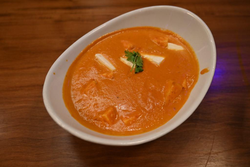 Paneer Makhni-D · Indian-style cheese cubes simmered in a tomato, onion, and cream-based sauce. Sauce available with vegetables, chicken, lamb or seafood. Served with a side of our vegan basmati rice. Gluten free.