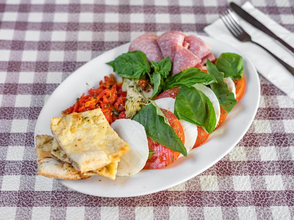 Antipasto for 2 · A platter of fresh mozzarella, sliced tomato, Genoa salami, sun-dried tomatoes, artichoke hearts and roasted peppers.
