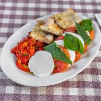Mozzarella and Tomato for 2 · Thick slices of fresh mozzarella and sliced tomato topped with roasted peppers.