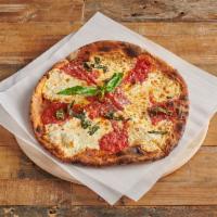 Margherita Pizza · Fresh mozzarella, tomato sauce, fresh basil and olive oil.