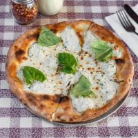 Pizza Bianca · Fresh mozzarella, ricotta, fresh basil and olive oil.