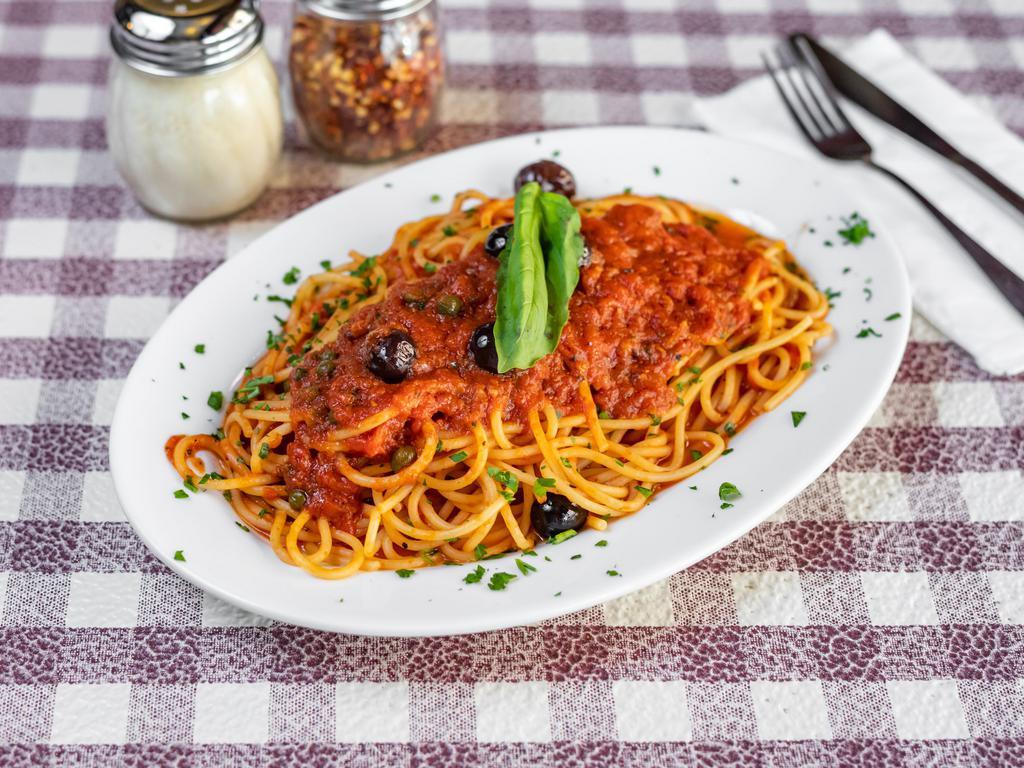 Spaghetti Puttanesca · Anchovies, capers and olives.