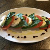 Caprese Salad · Sliced tomatoes arranged with fresh mozzarella and basil, drizzled with olive oil and balsam...