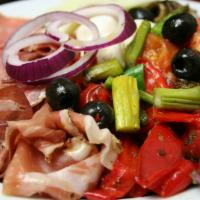 Antipasto Salad · Traditional antipasto with house greens, meats, cheese, olives. and peppers.