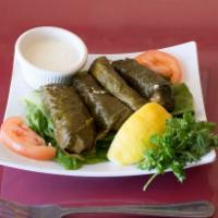 Dolma · Stuffed grape leaves. Stuffed with rice, pine nuts, currants, and chef's spices.