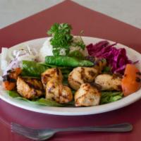 Chicken Shish Kebab · Chicken breast. Grilled cubes of marinated chicken, served on a bed of rice.