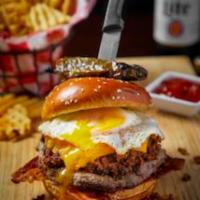 EL JEFE · Half pound burger topped with Chorizo, pepper jack cheese, peppered bacon, fried egg & toppe...