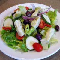 Italian Salad · Romaine lettuce with tomatoes, black olives, cucumber and artichokes.