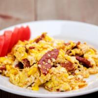 Omelette with Soujouk · Scrambled eggs with soujouk.
