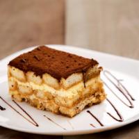 Tiramisu Cake · Coffee and zabaione cream on a layer of sponge cake soaked in espresso, dusted with cocoa po...