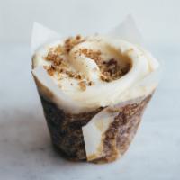 Carrot Cake Cupcake · Moist carrot-flecked cake with an even balance of spices and crunchy pecans (no raisins here...