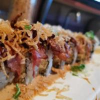 Steak Special Cooked Roll · Snow krab, avocado, crunchy inside, topped with ribeye steak, special sauce, and eel sauce.