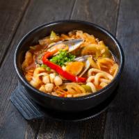 Spicy Seafood Udon · Chicken based broth soup with Japanese thick noodles and shrimp, squid, and mussels.