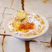 Labneh (GF) · Our homemade yogurt cheese. Comes with one Pita Bread.
