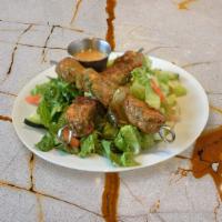 Chicken Kabob Salad (GF) · Grilled chicken breast pieces over crispy romaine lettuce, tomato, onion, cucumber and parsl...
