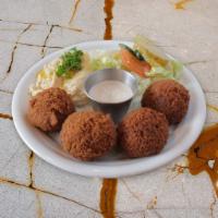 Falafel Plate (V,GF) · Four homemade falafels with hummus, side salad, and tahini sauce. Comes with one Pita Bread.