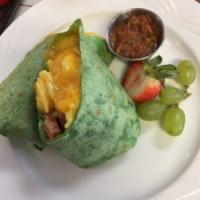 Breakfast Burrito · Scrambled eggs, bacon, sausage, jack and cheddar blend, in a grilled tortilla served with ho...