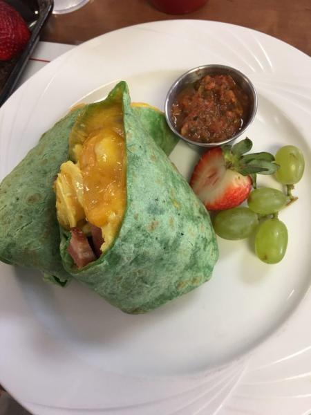 Breakfast Burrito · Scrambled eggs, bacon, sausage, jack and cheddar blend, in a grilled tortilla served with house made salsa.