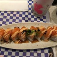 Seared Salmon Roll · Spicy tuna, cucumber, wrapped with seared salmon with soy mustard sauce.