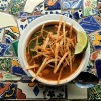 Tortilla Soup · Tomato and red chile broth with chicken, fried tortilla strips, avocado, and queso fresco.