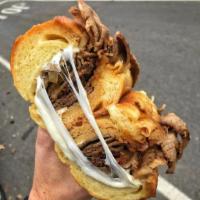 Graham Ave. Hero · Grilled roasted beef, smoked mozzarella, sauteed mushrooms and onions. 