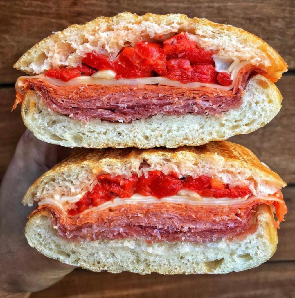 The Sanzese Panini · Hot cappi, pepperoni, soppressata, provolone with hot or sweet peppers. 