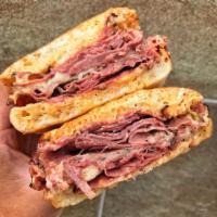 Triple Decker Panini · Pastrami, corned beef, melted Swiss with Russian dressing and sauerkraut. 