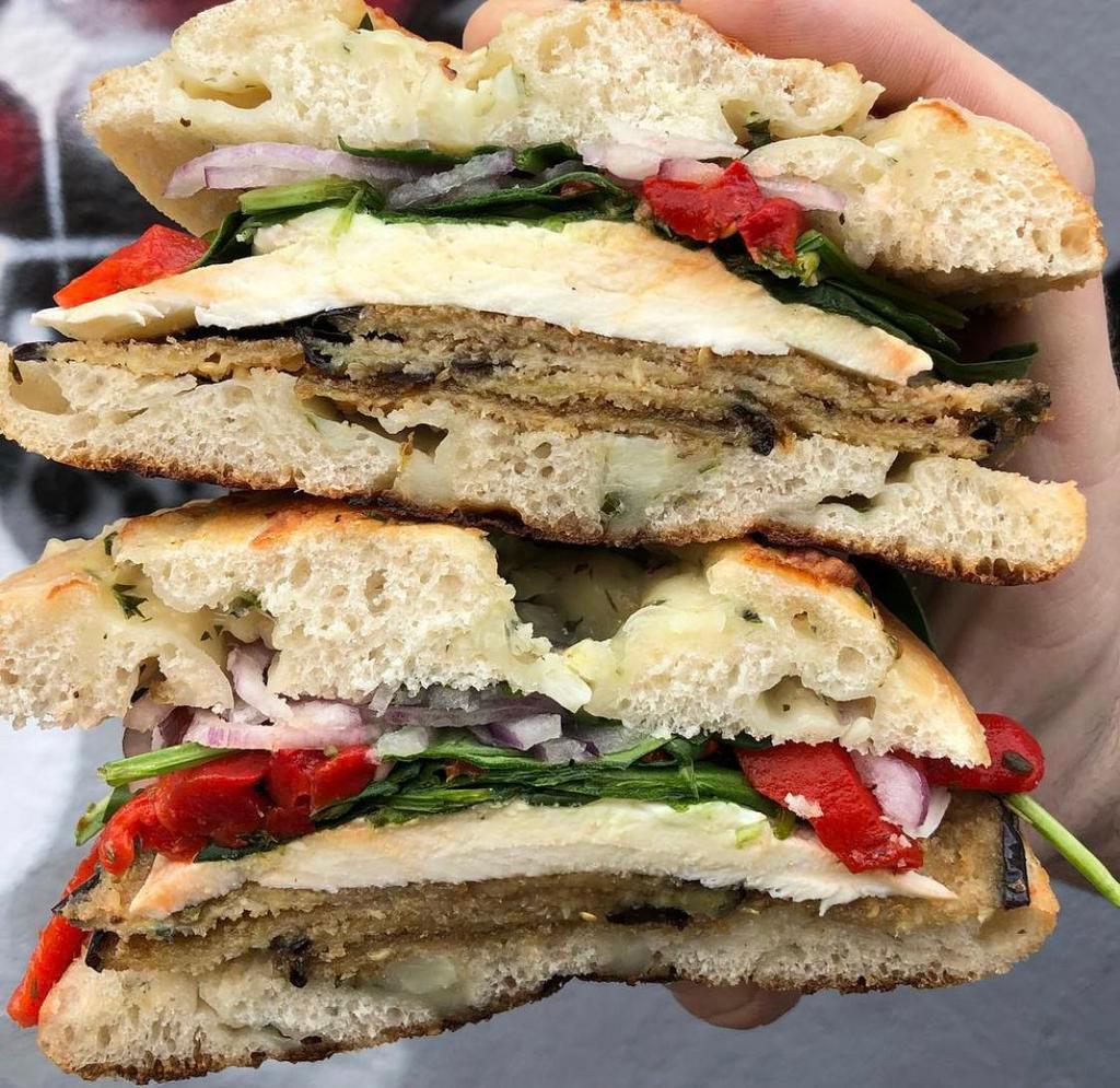 The Eggplant Special · Fried Eggplant, Fresh Mozzarella, Spinach, Red Onion, Roasted Peppers with Olive Oil & Balsamic Glaze on a Rosemary Panini