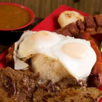 Bandeja Paisa · Large platter of rice, beans, grilled meat, chorizo, sweet plantain, and chicharron, topped ...