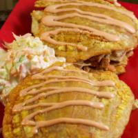 Patacon Sandwich · Fried plantain sandwich filled with lettuce, carrots, mayonnaise, tomatoes, and chicken or b...