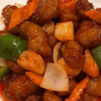 P1. Sweet and Sour Pork · Deep fried pork with bell pepper, onion, carrot, pineapple in sweet and sour sauce.