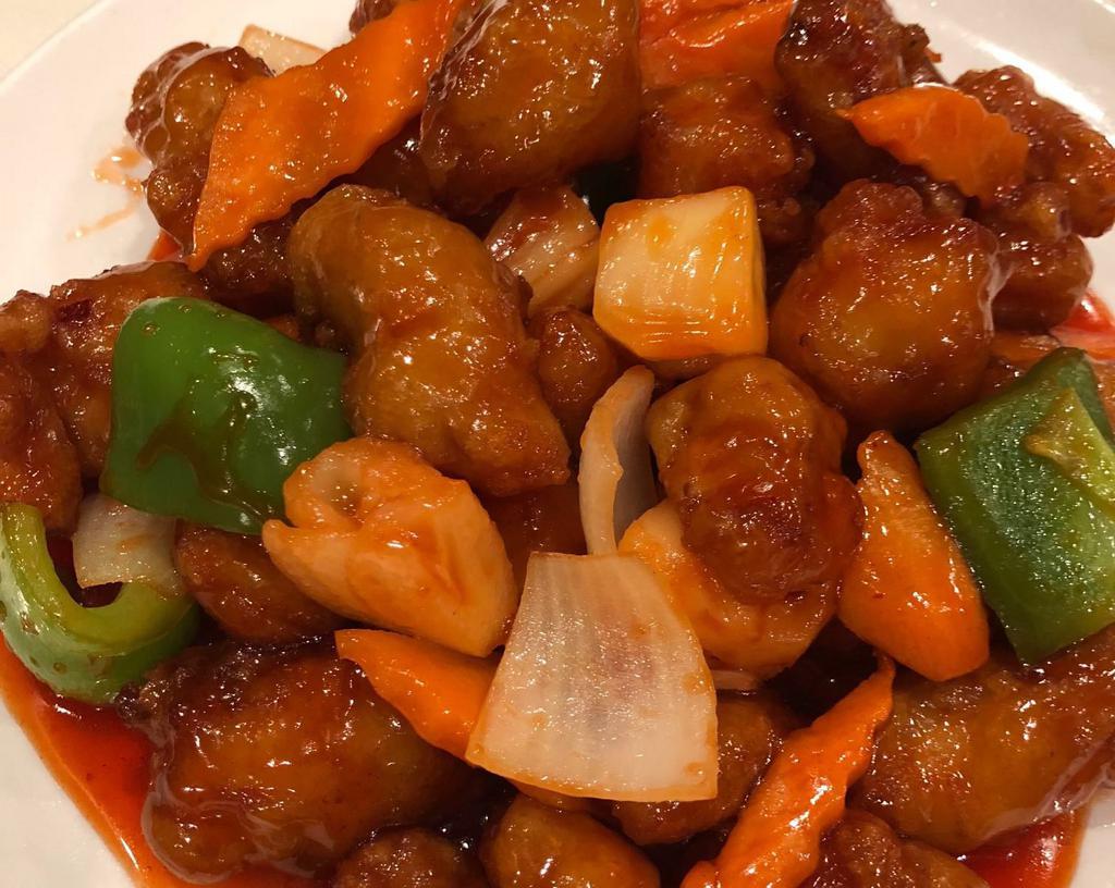 P1. Sweet and Sour Pork · Deep fried pork with bell pepper, onion, carrot, pineapple in sweet and sour sauce.
