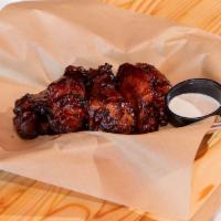 Smoked Chicken Wings · Jumbo wings dry rubbed and slow smoked, fried and tossed with your choice of sauce. Served w...
