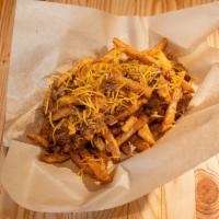 Messy Fries · Our signature seasoned fries tossed with your choice of smoked meat, BBQ sauce and cheese.