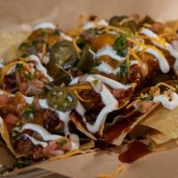 BrushFire Nachos · Crisp and thin tortilla chips topped with your choice of smoked meat, BBQ sauce and cheese. ...