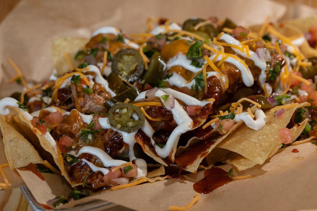 BrushFire Nachos · Crisp and thin tortilla chips topped with your choice of smoked meat, BBQ sauce and cheese. Topped with pico, jalapenos and sour cream.