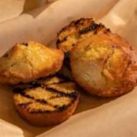 Corn Bread · Baked fresh daily, grilled with honey and butter.