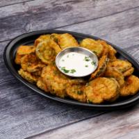 Fried Pickles · Crisp dill pickle chips, hand-battered and deep fried.