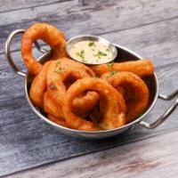 Battered Onion Rings · Served with our signature petal sauce.